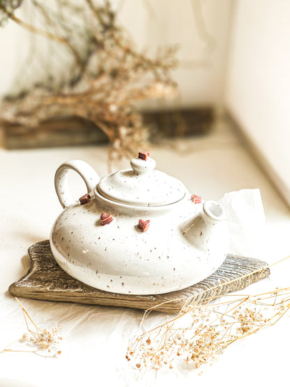 Ceramic teapot with a heart motif