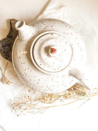 Ceramic teapot with a heart on lid