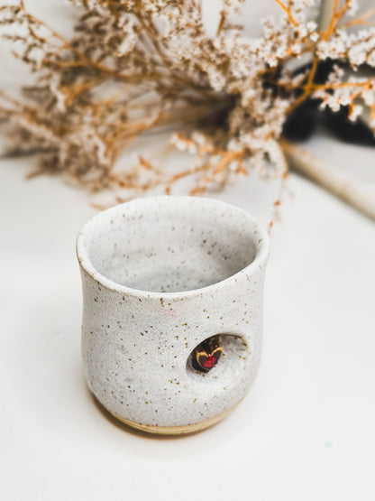 Ceramic handle-less coffee or tea mug with a heart motif