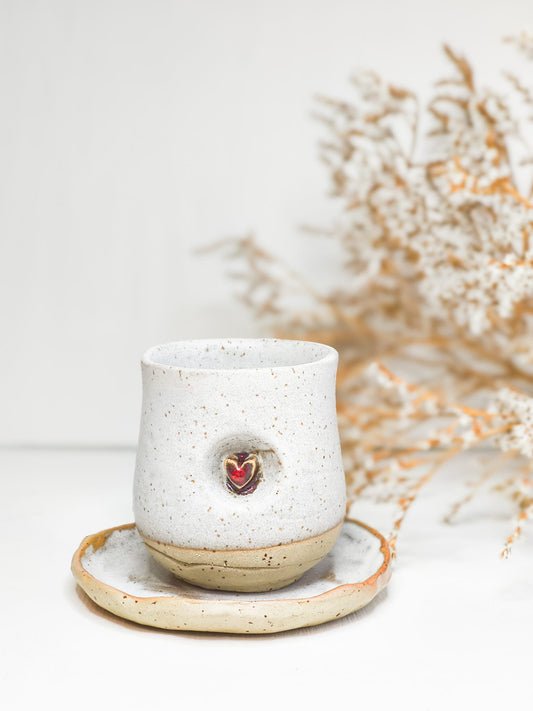 Ceramic handle-less coffee or tea mug with a heart motif
